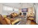 Spacious living room with ornate furniture and a fireplace at 9011 Pinnacle Cir, Windermere, FL 34786