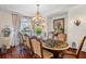 Formal dining room with large inlaid table at 9011 Pinnacle Cir, Windermere, FL 34786