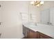 Simple bathroom with a vanity and mirror at 9011 Pinnacle Cir, Windermere, FL 34786