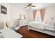 Bedroom with a comfortable bed and plenty of natural light at 9011 Pinnacle Cir, Windermere, FL 34786