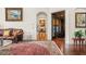 Living area with hardwood floors, ornate furniture, and views to other rooms at 9011 Pinnacle Cir, Windermere, FL 34786