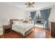 Bedroom with hardwood floors and a ceiling fan at 9011 Pinnacle Cir, Windermere, FL 34786