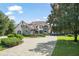 Impressive home with a fountain and paved driveway at 9011 Pinnacle Cir, Windermere, FL 34786