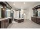 Spa-like bathroom with a soaking tub, double vanities, and separate shower at 9011 Pinnacle Cir, Windermere, FL 34786
