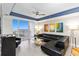 L-shaped sectional sofa, coffee table, and balcony access at 13427 Blue Heron Beach Dr # 405, Orlando, FL 32821