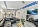 Spacious living room with sectional sofa and a large TV at 13427 Blue Heron Beach Dr # 405, Orlando, FL 32821