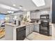 Updated kitchen featuring granite countertops and stainless steel appliances at 13427 Blue Heron Beach Dr # 405, Orlando, FL 32821