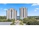 Two high rise waterfront buildings with parking and landscaping at 13427 Blue Heron Beach Dr # 405, Orlando, FL 32821