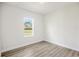 Simple bedroom featuring a window and vinyl flooring at 5277 Sw 165Th Street Rd, Ocala, FL 34473
