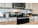 Modern kitchen with stainless steel appliances and granite countertops at 3901 Botancial Court, Sanford, FL 32773