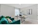 Spacious home office with teal armchairs and window at 3901 Botancial Court, Sanford, FL 32773