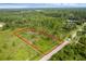 Buildable lot with mature trees, offering a secluded setting with easy access to roads at 30808 Apricot Ave, Eustis, FL 32736