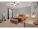 Main bedroom with a king-size bed, large window, and ceiling fan at 237 Lake View Dr, Sanford, FL 32773