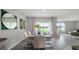 Modern dining area with white chairs and large sliding doors leading to backyard at 3907 Botancial Court, Sanford, FL 32773