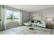 Bright living room featuring a comfortable sectional sofa and large window at 3907 Botancial Court, Sanford, FL 32773