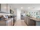 Modern kitchen with stainless steel appliances and granite countertops at 3907 Botancial Court, Sanford, FL 32773