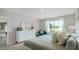 Bright main bedroom with a comfortable bed and large window at 3907 Botancial Court, Sanford, FL 32773