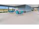 Covered patio with tables and chairs for residents at 3907 Botancial Court, Sanford, FL 32773