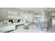 Open living space with a white sectional sofa and gray accent chair at 3907 Botancial Court, Sanford, FL 32773