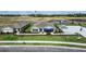 Aerial view of community featuring model homes and landscaping at 3907 Botancial Court, Sanford, FL 32773
