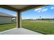 Covered patio overlooking a large grassy backyard at 3907 Botancial Court, Sanford, FL 32773