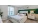 Cozy bedroom with a plush bed and modern nightstand at 3907 Botancial Court, Sanford, FL 32773