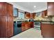Updated kitchen with stainless steel appliances and granite countertops at 701 Castlewood Dr, Winter Springs, FL 32708