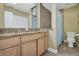 Bathroom with double vanity and granite countertops at 701 Castlewood Dr, Winter Springs, FL 32708