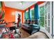 Home office featuring a desk, chair, and comfortable couch at 701 Castlewood Dr, Winter Springs, FL 32708