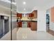 Modern kitchen featuring stainless steel appliances and dark wood cabinets at 701 Castlewood Dr, Winter Springs, FL 32708