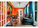 Bright home office with a large window and comfortable seating at 701 Castlewood Dr, Winter Springs, FL 32708