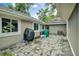 Brick paved patio with grill and storage space at 701 Castlewood Dr, Winter Springs, FL 32708