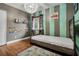 bedroom with wood floors, playful decor, and a twin-size bed at 701 Castlewood Dr, Winter Springs, FL 32708