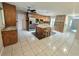 Kitchen boasting wood cabinets, granite countertops, and a large island at 425 E Hillcrest St, Altamonte Springs, FL 32701