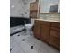 Clean bathroom with shower, toilet and wooden vanity at 425 E Hillcrest St, Altamonte Springs, FL 32701