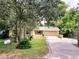 House exterior with driveway and landscaping at 425 E Hillcrest St, Altamonte Springs, FL 32701