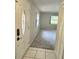 Bright entryway with tiled floors, neutral walls, and a view into a carpeted living area at 425 E Hillcrest St, Altamonte Springs, FL 32701