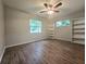 Well-lit bedroom with ceiling fan and wood-look flooring at 425 E Hillcrest St, Altamonte Springs, FL 32701