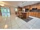 Kitchen featuring wood cabinets, granite countertops, and a large island at 425 E Hillcrest St, Altamonte Springs, FL 32701