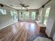 Sunroom with wood flooring, built-in bench seating, and abundant natural light at 425 E Hillcrest St, Altamonte Springs, FL 32701