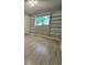 Bright bedroom featuring built-in shelving and wood flooring at 425 E Hillcrest St, Altamonte Springs, FL 32701