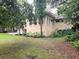 House exterior showcasing the side of the home and landscaping at 425 E Hillcrest St, Altamonte Springs, FL 32701