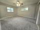 Primary bedroom with carpeted floors, neutral walls, and ceiling fan at 425 E Hillcrest St, Altamonte Springs, FL 32701
