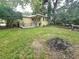 Large backyard with grassy area and wooden deck at 425 E Hillcrest St, Altamonte Springs, FL 32701
