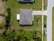 Overhead view of a single-Gathering home with a gray roof and grassy yard at 781 Marion Oaks Trl, Ocala, FL 34473
