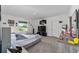 Main bedroom with a large bed, dresser, and plenty of space at 781 Marion Oaks Trl, Ocala, FL 34473