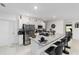 Modern kitchen with stainless steel appliances and a large granite island at 781 Marion Oaks Trl, Ocala, FL 34473