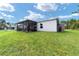 House exterior with a screened patio and storage shed at 781 Marion Oaks Trl, Ocala, FL 34473