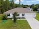 One-story home with two-car garage and landscaped yard at 781 Marion Oaks Trl, Ocala, FL 34473
