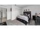 Bedroom with a black platform bed, dresser, and carpet flooring at 781 Marion Oaks Trl, Ocala, FL 34473